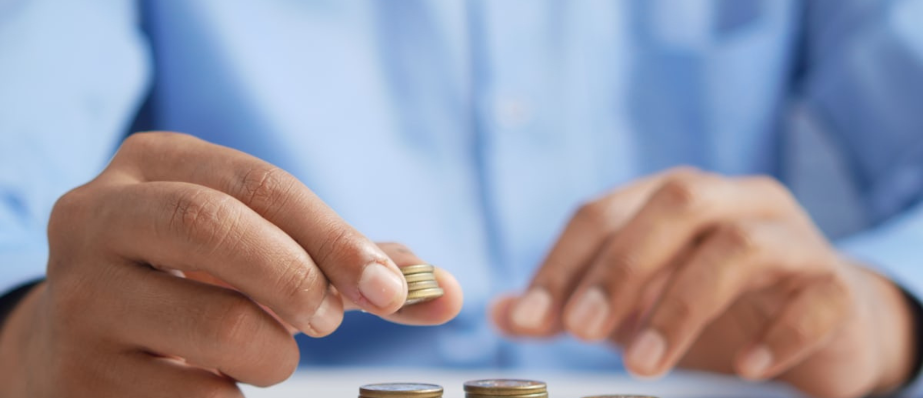 Young professional working remotely on laptop with digital money icons and graphs, illustrating best ways to earn money online in 2026